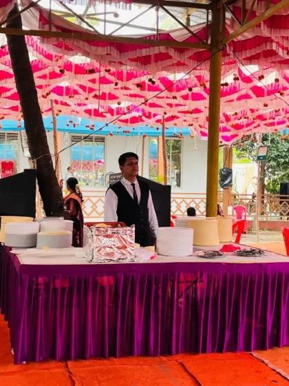 A food station set up under a pandal for a wedding in Pen. I ensure the food is well protected and served hygienically, no matter the location.