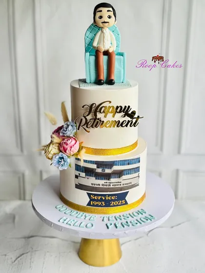 Celebrating a legacy of dedication and service. This two-tier retirement cake features a custom fondant figurine of the retiree relaxing in his chair.