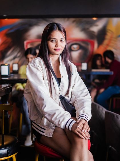 A guest posing against the graffiti wall.