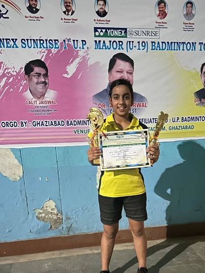 **U.P. Major U-19 Girls' Singles Champion.** Divyanshi Gautam with her trophies after securing the Gold medal in the U-19 Girls' Singles category.
