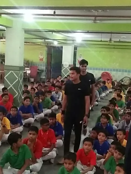 Our instructors moving through the crowd to provide individual guidance during a large self-defense class for schoolboys.
