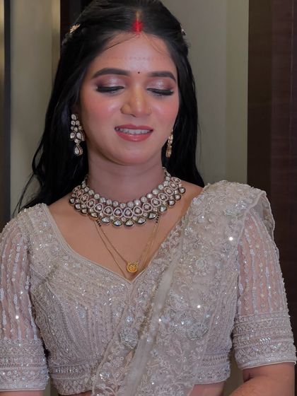 A close-up of the reception makeup, featuring shimmery eyes and a flawless base.