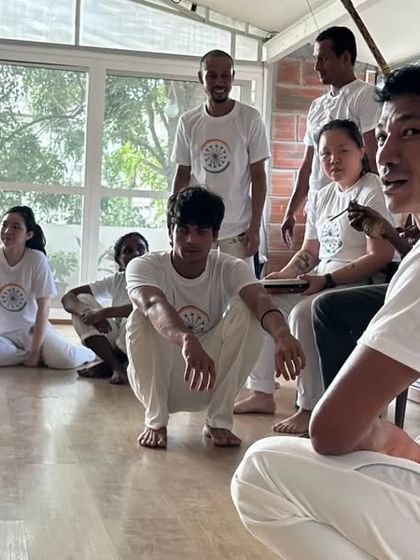 The bateria, or orchestra, is the heart of the roda. Here, students and teachers sit together, playing instruments and singing to create the energy for the game.