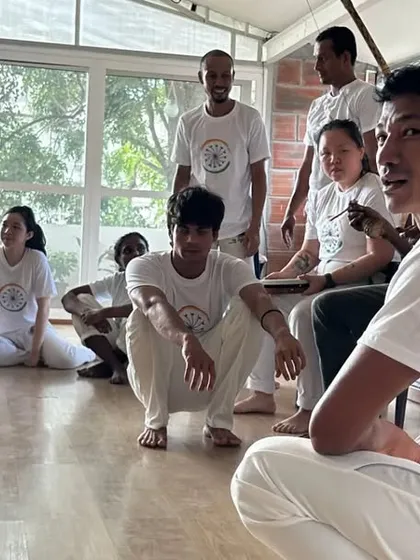 The bateria, or orchestra, is the heart of the roda. Here, students and teachers sit together, playing instruments and singing to create the energy for the game.