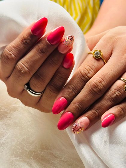 This is my Miler nail art style. It combines a beautiful pink polish with an accent nail featuring a cascade of colorful, shiny flakes.