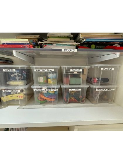 Clear, labeled bins are perfect for storing smaller toys and art supplies like chalk, crayons, and blocks. This makes cleanup time a simple matching game.