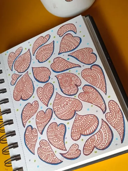 When my mind feels cluttered, I turn to my sketchbook and let my pen wander. These little zentangle hearts are the result of one such meditative session, a simple and personal way to find my calm.