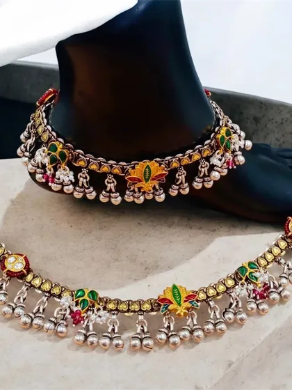 Shine with every step in our silver fusion payal. These anklets feature colourful meenakari work and silver ghungroo bells for a beautiful sound.