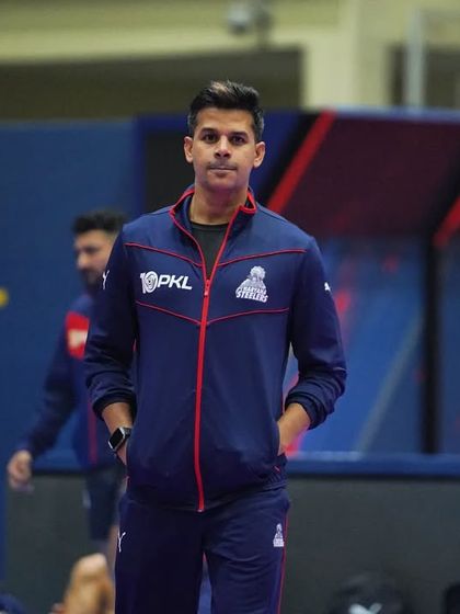 A moment of focus on the mat. The lights are bright, but the focus is internal.