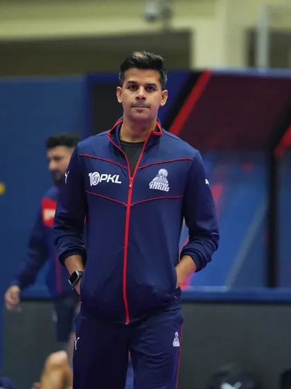 A moment of focus on the mat. The lights are bright, but the focus is internal.