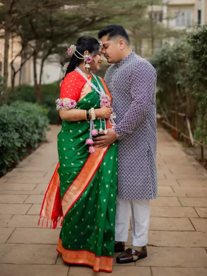 An intimate pose between the couple, capturing the quiet connection and excitement during their maternity celebration.