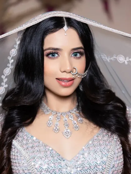 A beautiful shot of the modern reception look, with the bride looking up, framed by a delicate veil. This is the kind of shot that gets you noticed on Instagram.