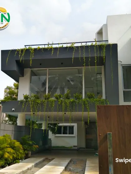We help businesses make a powerful first impression by integrating lush greenery with their architecture. For this modern building, we designed and installed cascading plants that soften the structure and create a vibrant, welcoming facade.