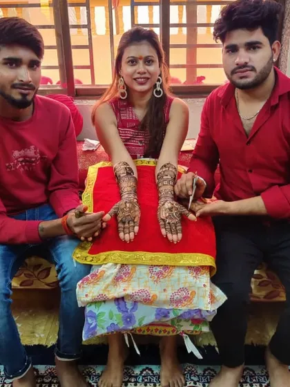 Two of our team members with a happy client. We work as a coordinated team to make every mehandi session a success.