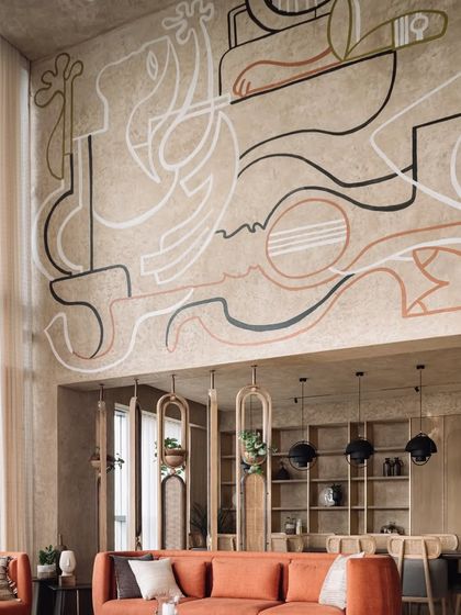 A detail shot of the line-art mural, highlighting the clean lines and abstract figures that define this piece.