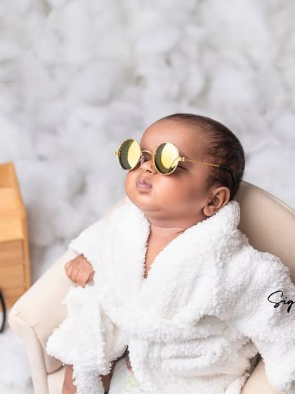 The epitome of cool. This baby is rocking his sunglasses and bathrobe in a cloud of cottony softness.