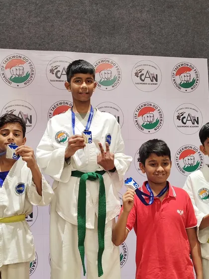 Our young male athletes celebrate their medal wins at the 20th National ITF Championship, showing great camaraderie.