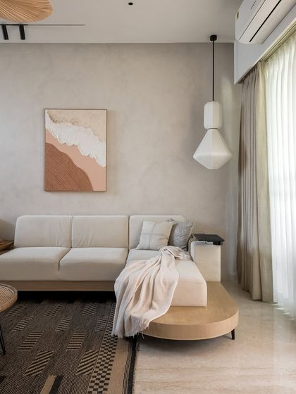 Rooted in simplicity, this living room from our Gran Carmen project is a celebration of mindful luxury. The walls feature organic Nilaya paint, and every detail, from the textured rug to the sculptural fan, was curated for longevity and soul.