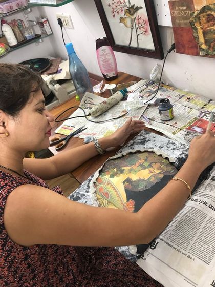 The process of creating a mixed-media piece involves many steps, including tearing paper, applying textures, and layering images. It's a wonderfully creative and forgiving art form.