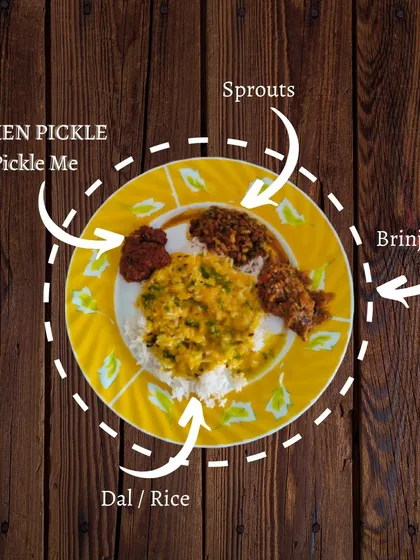 This is what a perfect meal looks like to us. A simple plate of dal and rice transformed into a flavour-packed delight with a spoonful of our homemade Chicken Pickle and Brinjal Pickle. It’s how we bring a little extra joy to your dining table.