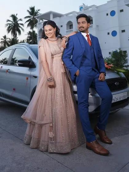 A romantic couple shot at their reception. The bride's flowing lehenga and soft makeup create a dreamy and elegant picture.
