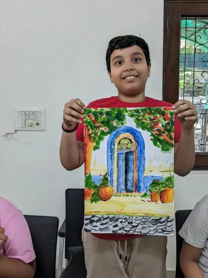 Another beautiful piece by our star student, Shaurya. This watercolor painting of a blue door in a sunlit alley shows his growing confidence with landscapes.
