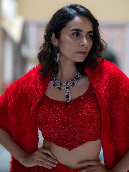 A closer look at the red sequin top and ruby jewelry, part of our glam rental collection.