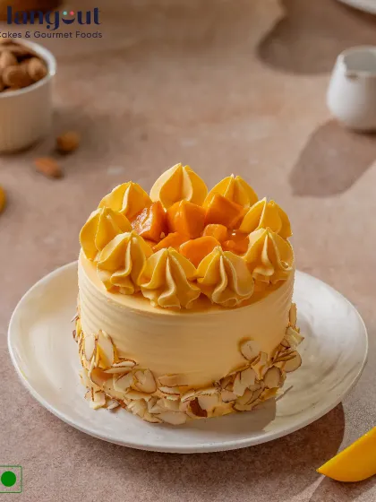 This is what mango dreams are made of. Our classic Alphonso Mango Cake is creamy, fluffy, and packed with real mango flavor, finished with toasted almonds for a bit of crunch.