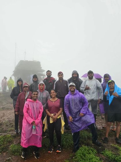 The group at the Sarvajna Peetha, the small temple at the very top of Kodachadri peak, shrouded in mist.
