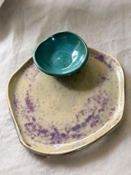 A chip-and-dip platter with a unique, free-form shape. The purple splashes on the plate and the deep teal of the bowl are characteristic of my experimental approach to glazing for the Kaleidoscope Collection.