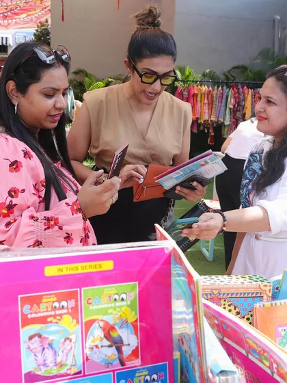 Interacting with customers at an outdoor pop-up event is one of my favorite things to do. It's a great way to understand what parents are looking for and share my passion for children's literature.