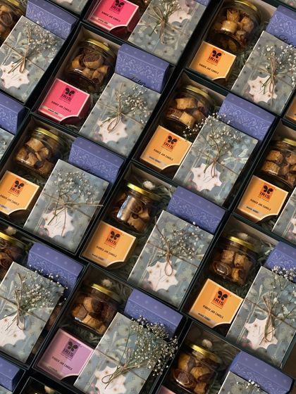 An overhead view of the wedding invitation hampers, showing the consistent, beautiful arrangement in each box.