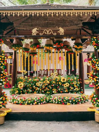 A closer look at a vibrant Haldi mandap, bursting with the color of sunflowers and marigolds. Our floral artistry focuses on creating textures and layers that bring energy and traditional significance to your pre-wedding rituals.