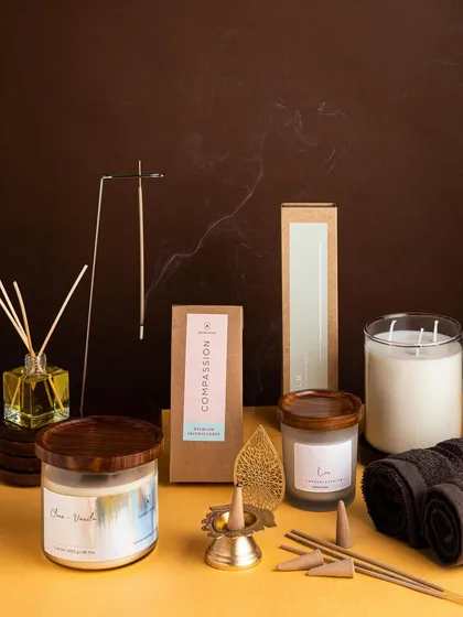 A complete sensory experience from our Spa collection. This flat lay showcases our Clove & Vanilla candle alongside our herbal incense sticks and cones, a reed diffuser, and other elements for ultimate relaxation.