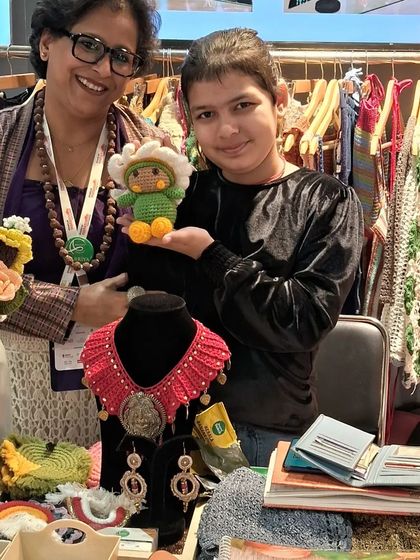 A young visitor at Startup Mahakumbh, delighted to hold one of our cute amigurumi toys. It's always a joy to see the happiness our creations bring.