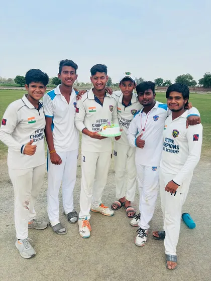 Happy Birthday, Sunny. The team celebrating their captain's birthday with a cake on the field.