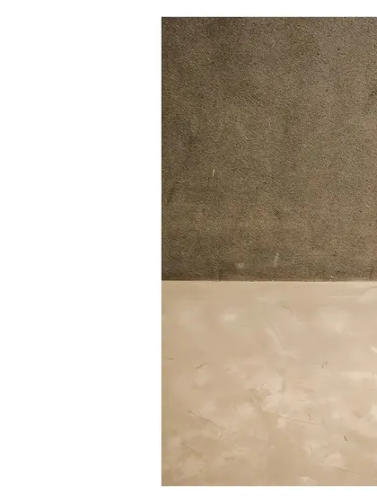 A study in texture for a gallery and party space. The floor and walls are finished in a seamless gray concrete, creating a neutral, elemental backdrop that allows the atmosphere and the people within it to make the space.