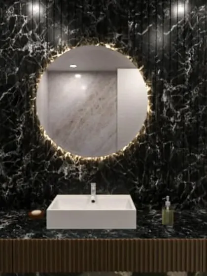 Another stunning bathroom concept, this time with dramatic black marble and a circular backlit mirror.