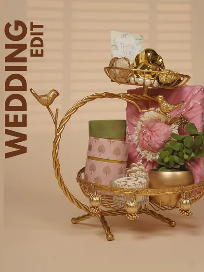 Presentation is everything to me. This elegant two-tiered golden stand is one of the many ways I package my wedding favors and return gifts, turning a simple thank you into a beautiful decorative piece.