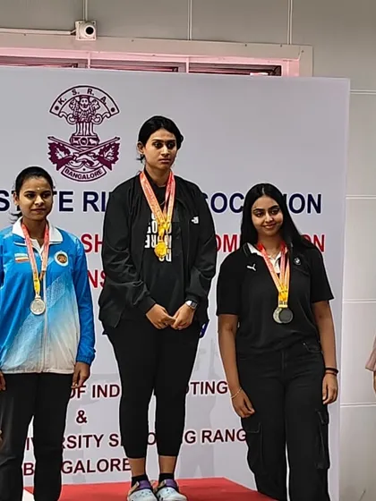 Shivani on the top of the podium after winning two Gold medals in the 25m Sports Pistol senior and junior women's events at the Karnataka State Competition.