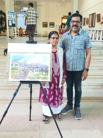 Standing with a fellow artist next to the finished piece from my live watercolour demo on light and shadow at CKP.