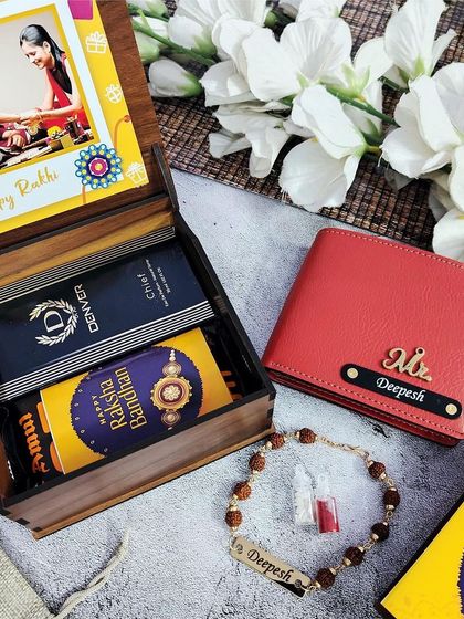 The same premium Rakhi combo, but with a red personalized wallet. You can customize the name on the wallet and rakhi, and add a special photo to the wooden box.