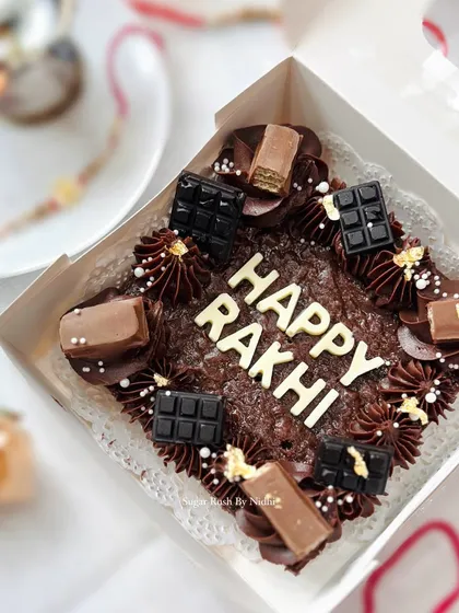 A 'Happy Rakhi' brownie slab, loaded with different chocolates. A fun and modern way to celebrate the festival.