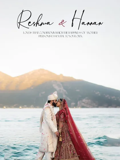 A breathtaking destination wedding portrait. The couple shares a kiss with a stunning backdrop of mountains and the sea, a truly epic shot.
