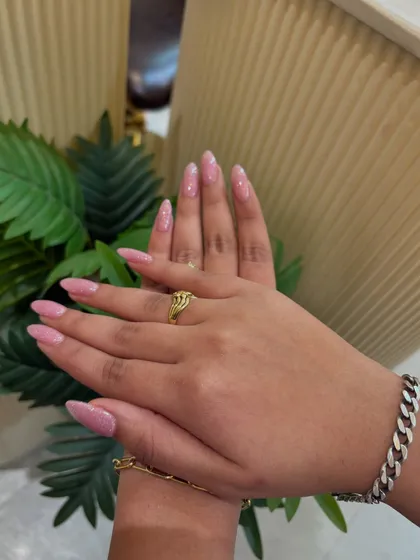 Another shot of our lovely pink glitter nails, a popular choice for clients of all ages.