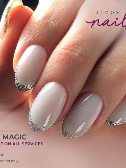 A beautiful, soft French manicure with a silver glitter tip for a subtle touch of sparkle.