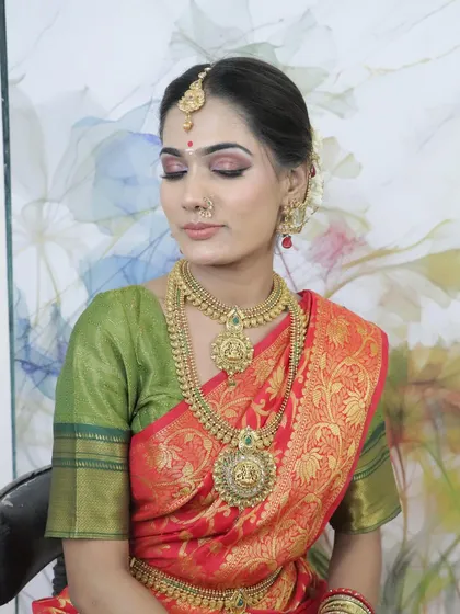 The same South Indian look with eyes closed, highlighting the beautiful pink and gold eyeshadow work. This shows the detail and precision taught at my academy.