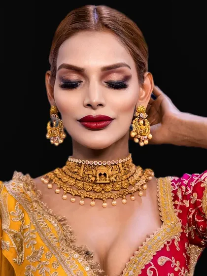 Eyes closed, this shot highlights the beautiful eyeshadow work. The warm, earthy tones are blended seamlessly to create a soft yet defined look.