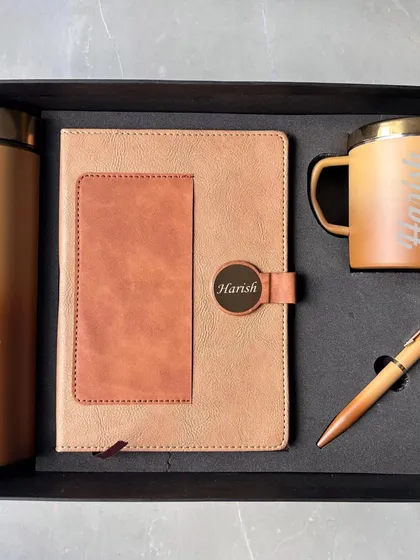 To showcase individual personalization on this style, here is the same set customized for "Harish". The name is elegantly engraved on the diary's metal clasp and the mug, adding a touch of personal recognition.