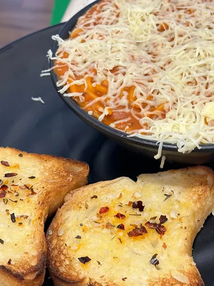 My Red Sauce Spaghetti Pasta is a classic Italian dish done right. It's tangy, flavourful, and topped with a generous amount of cheese.